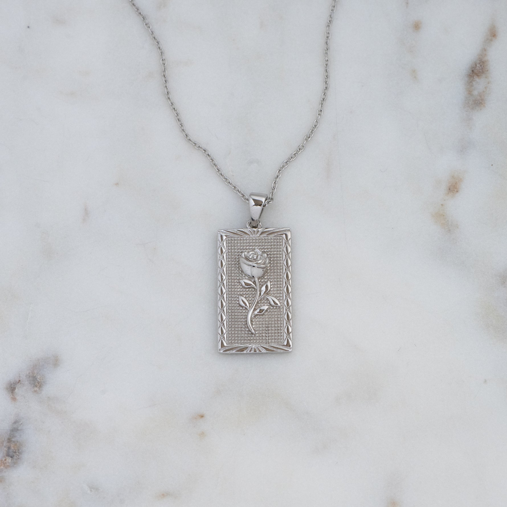 Silver medallion rose rectangle pendant necklace. 