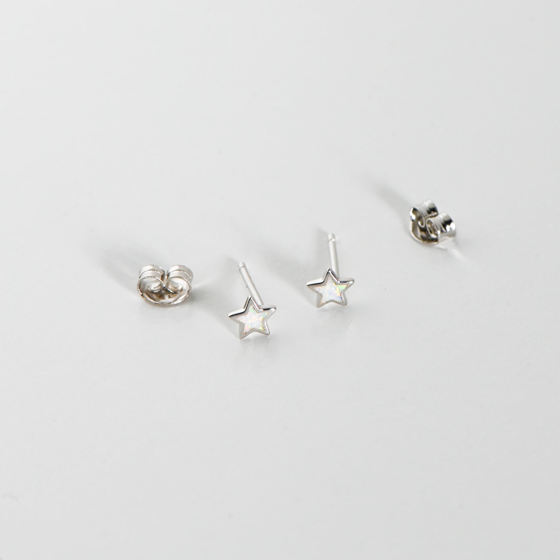 Silver opal star celestial stud earrings