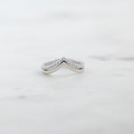 Upclose image of sterling silver chevron ring set with one pavé band and one plain band