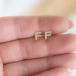 Small and dainty letter initial stud earrings in gold over sterling silver. 