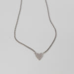 Sterling silver heart pendant necklace with curb link chain.