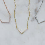 Chevron necklace in gold, rose gold, and silver.