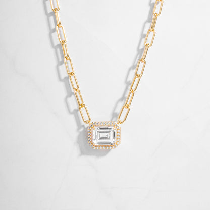 a necklace with a baguette and a chain
