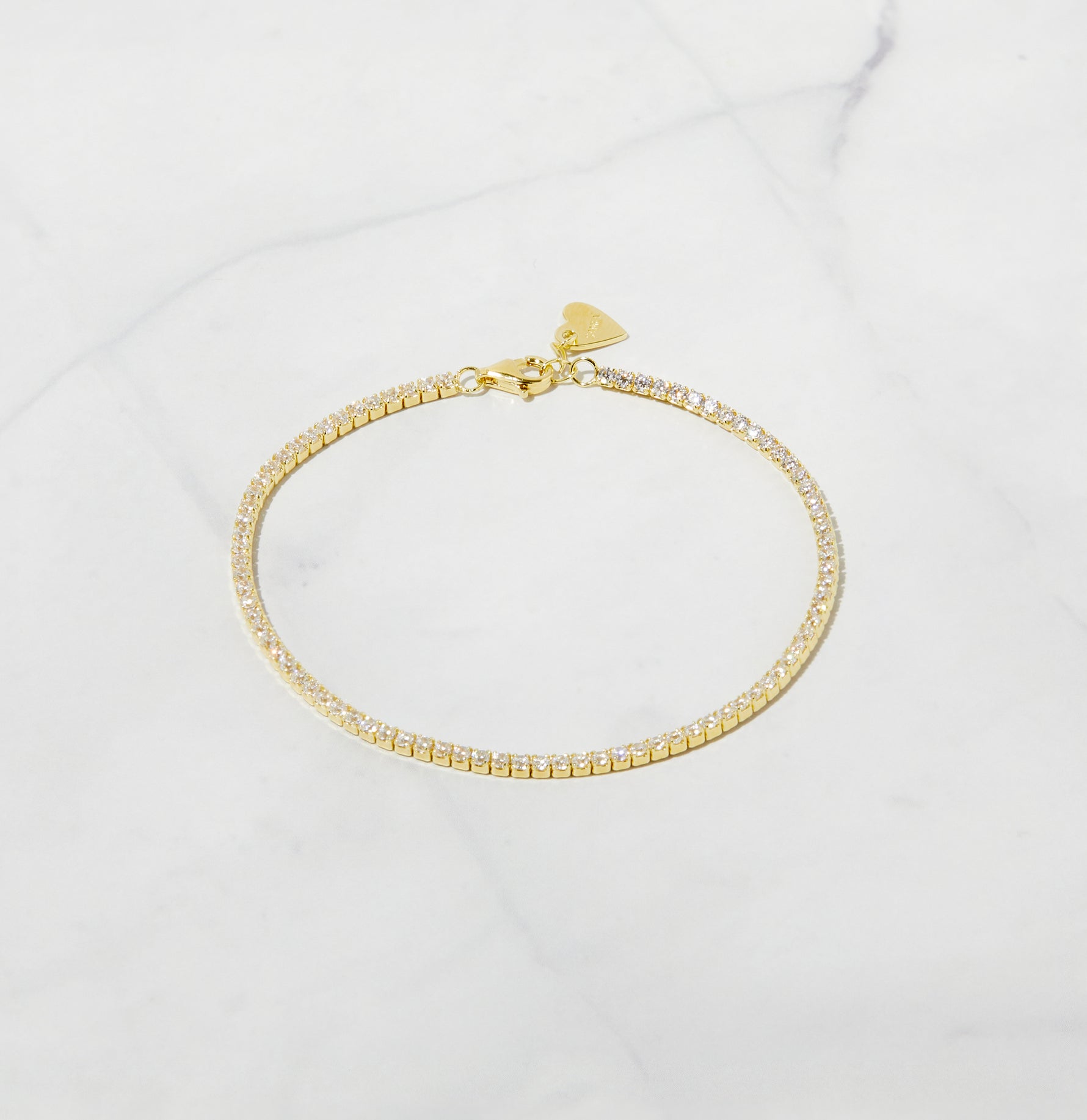 1.75mm Tennis Bracelet featuring brilliant cubic zirconia stones on a white background, showcasing minimalist design and elegant sparkle.