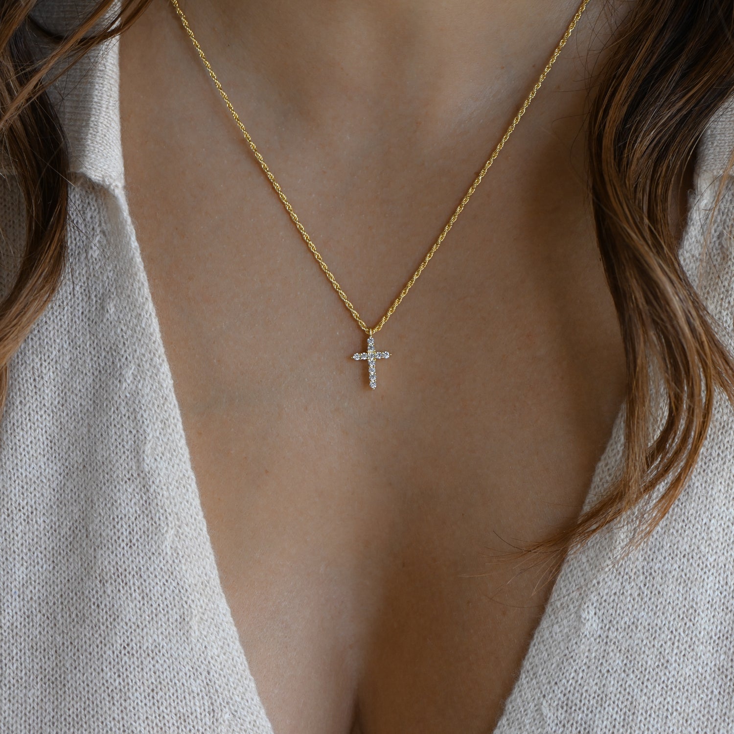 delicate tiny cross necklace in gold