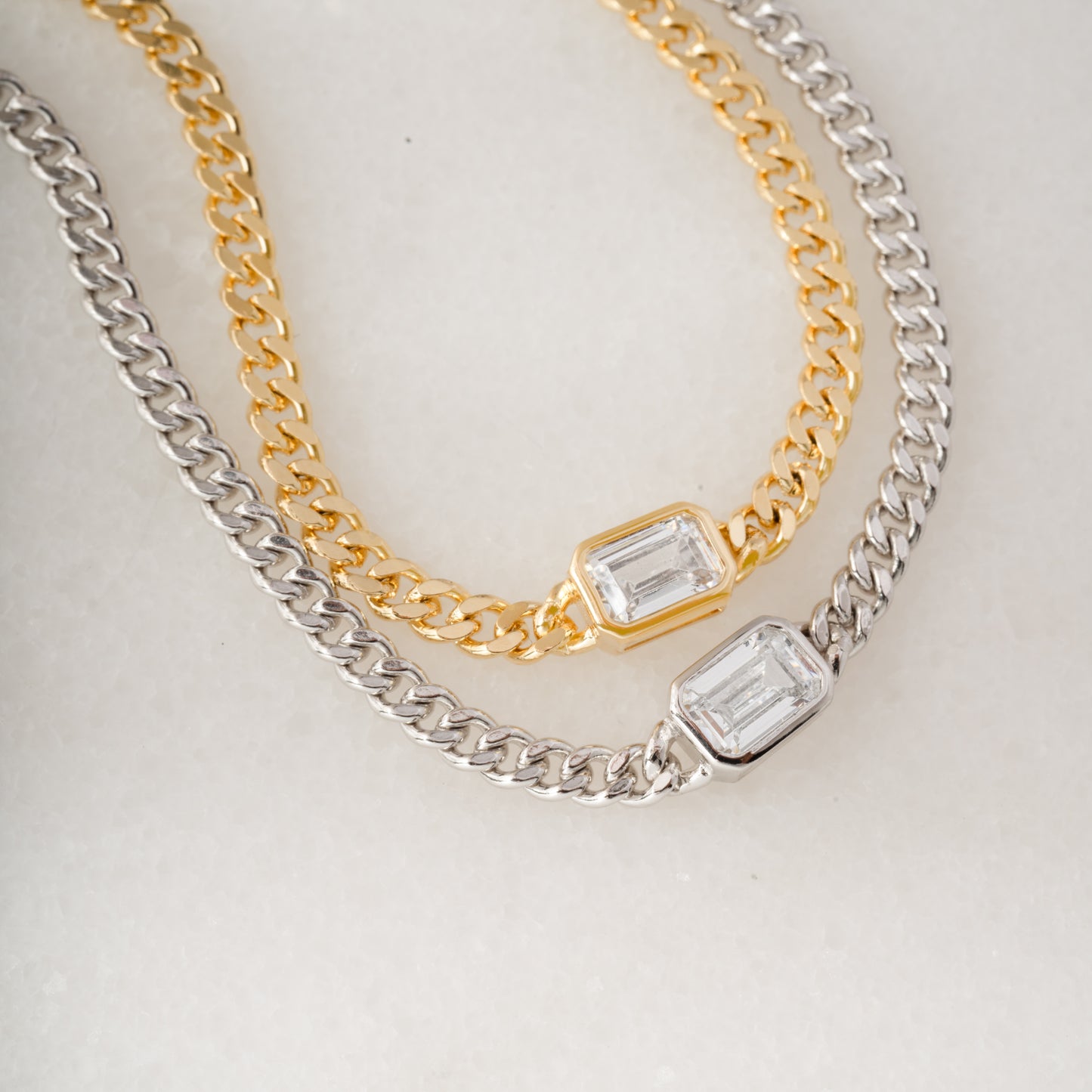 gold and silver minimalist curb chain bracelets with cz bezel baguette charm