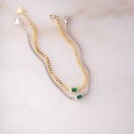 gold and silver emerald halo charm on curb chain bracelets