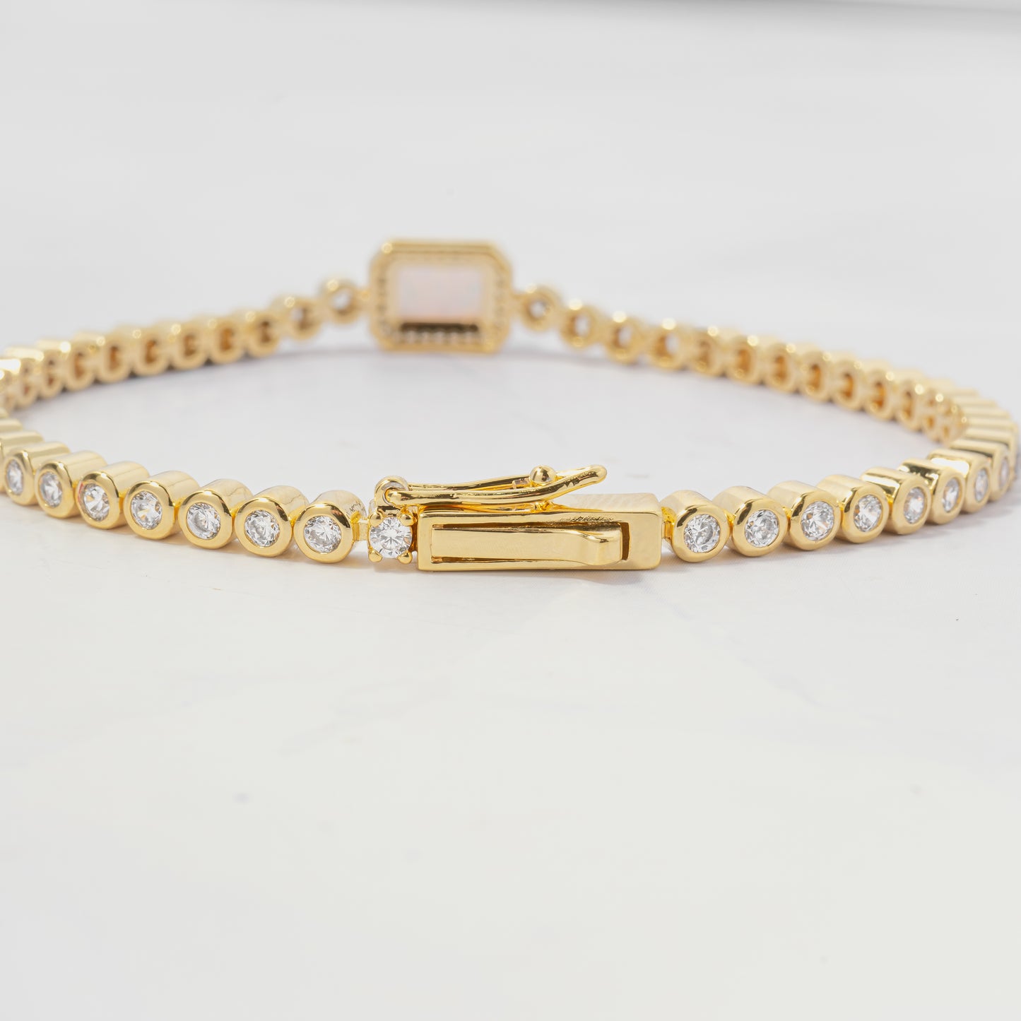 dainty gold tennis bracelet with box closure