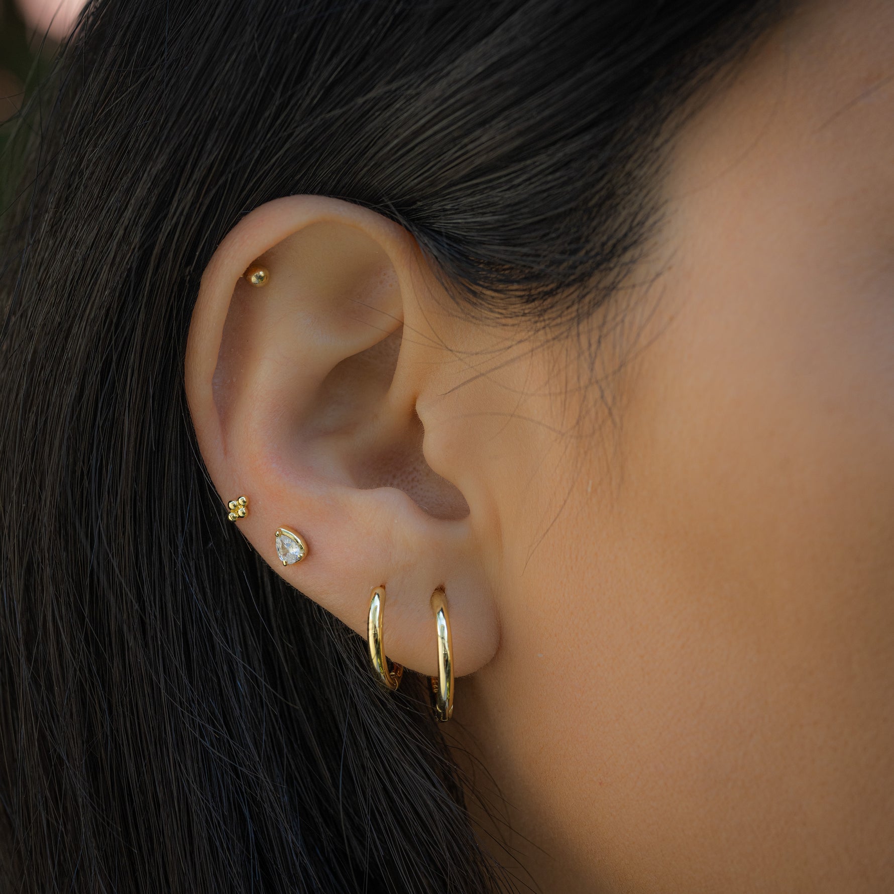 Simple hoop earrings and stackable studs from Sami Jewels
