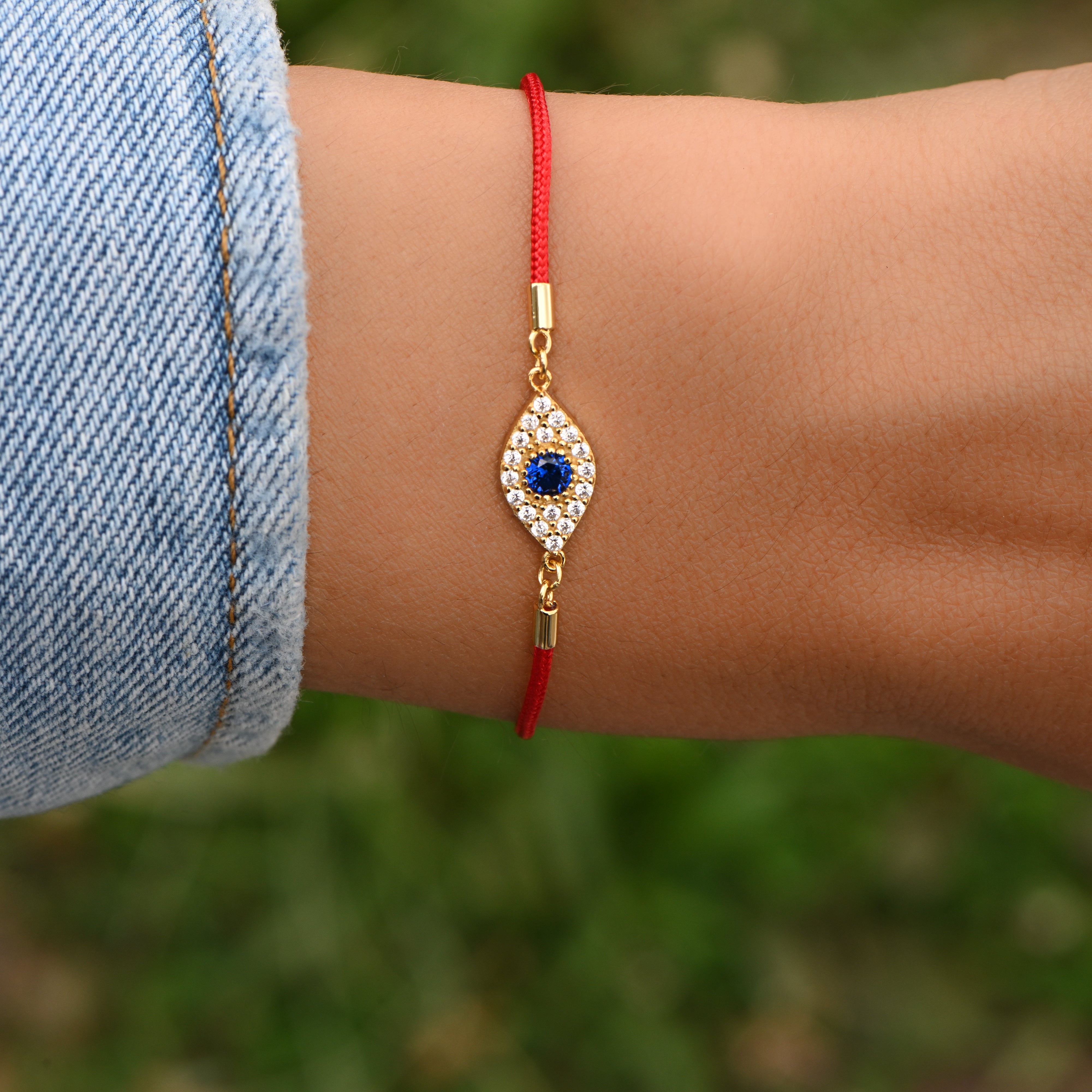 Red bracelet on sale with eye