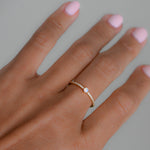 closeup image of opal stacking ring with cubic zirconia stones