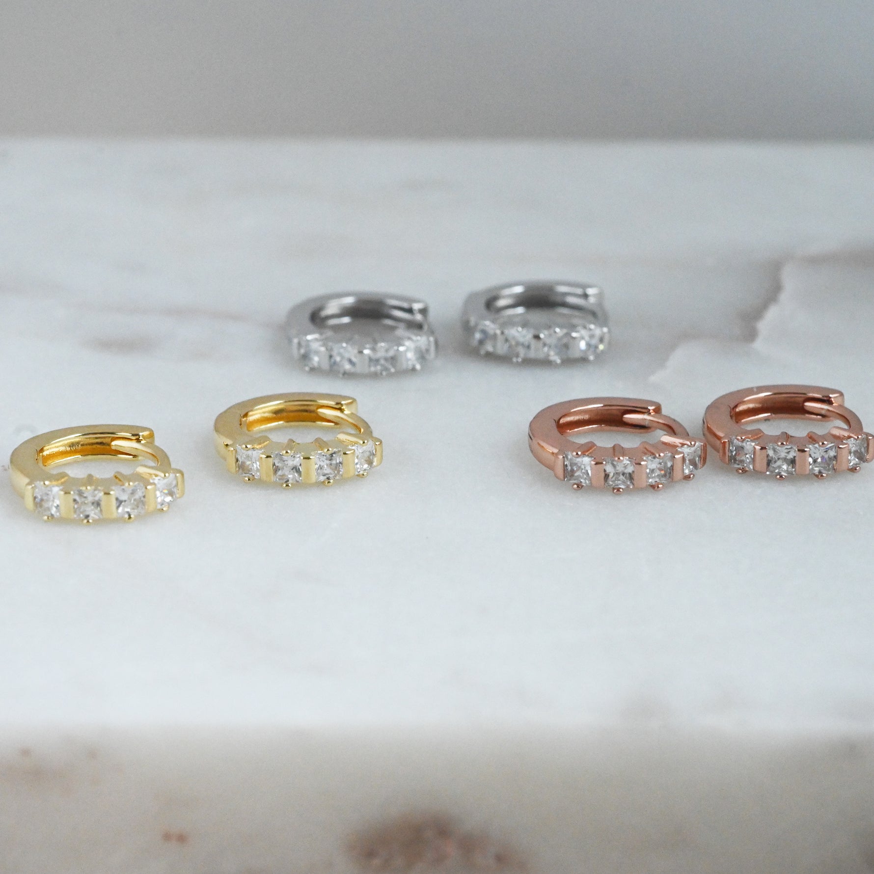 image showing gold, silver and rose gold small hoop earrings