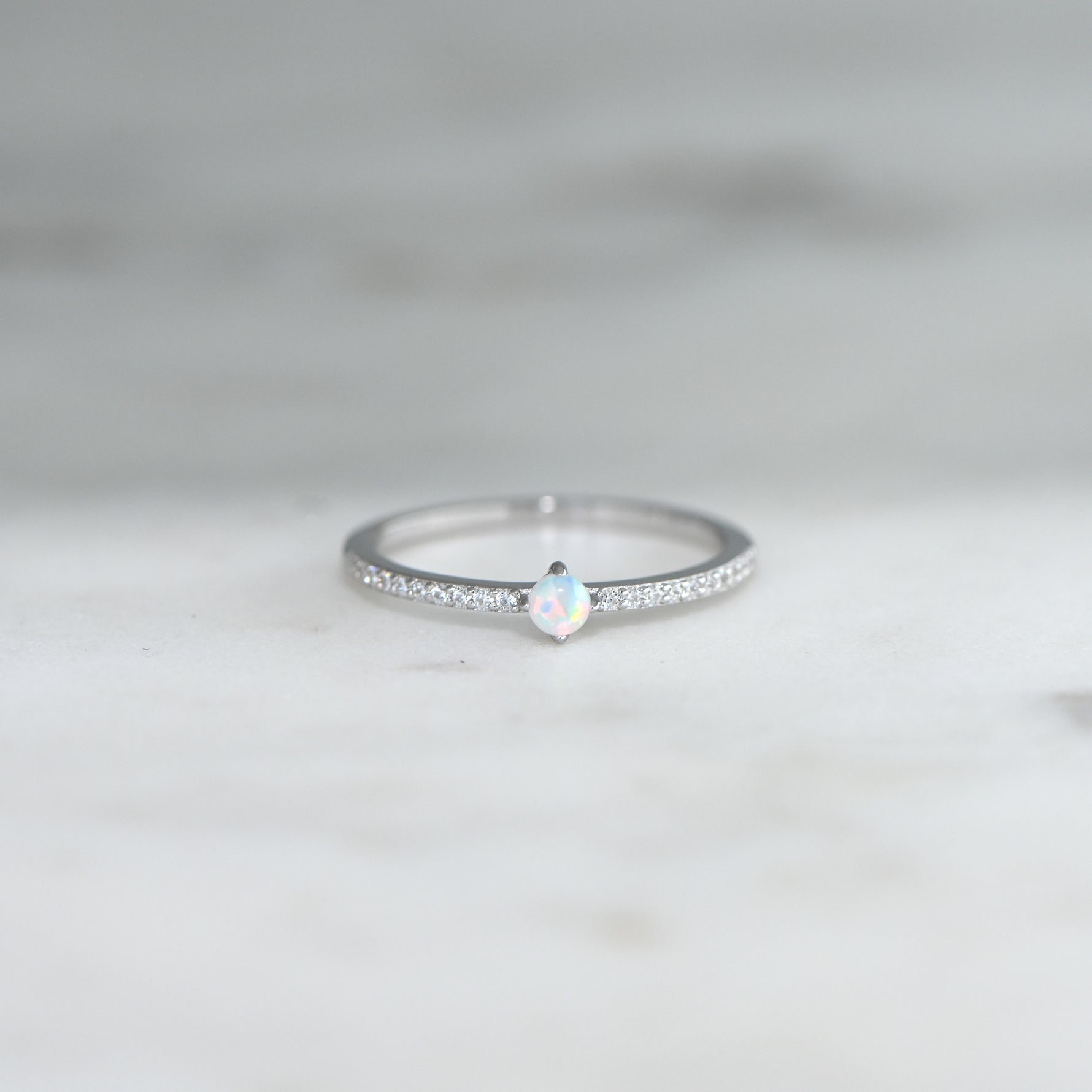 closeup image of silver opal stacking band
