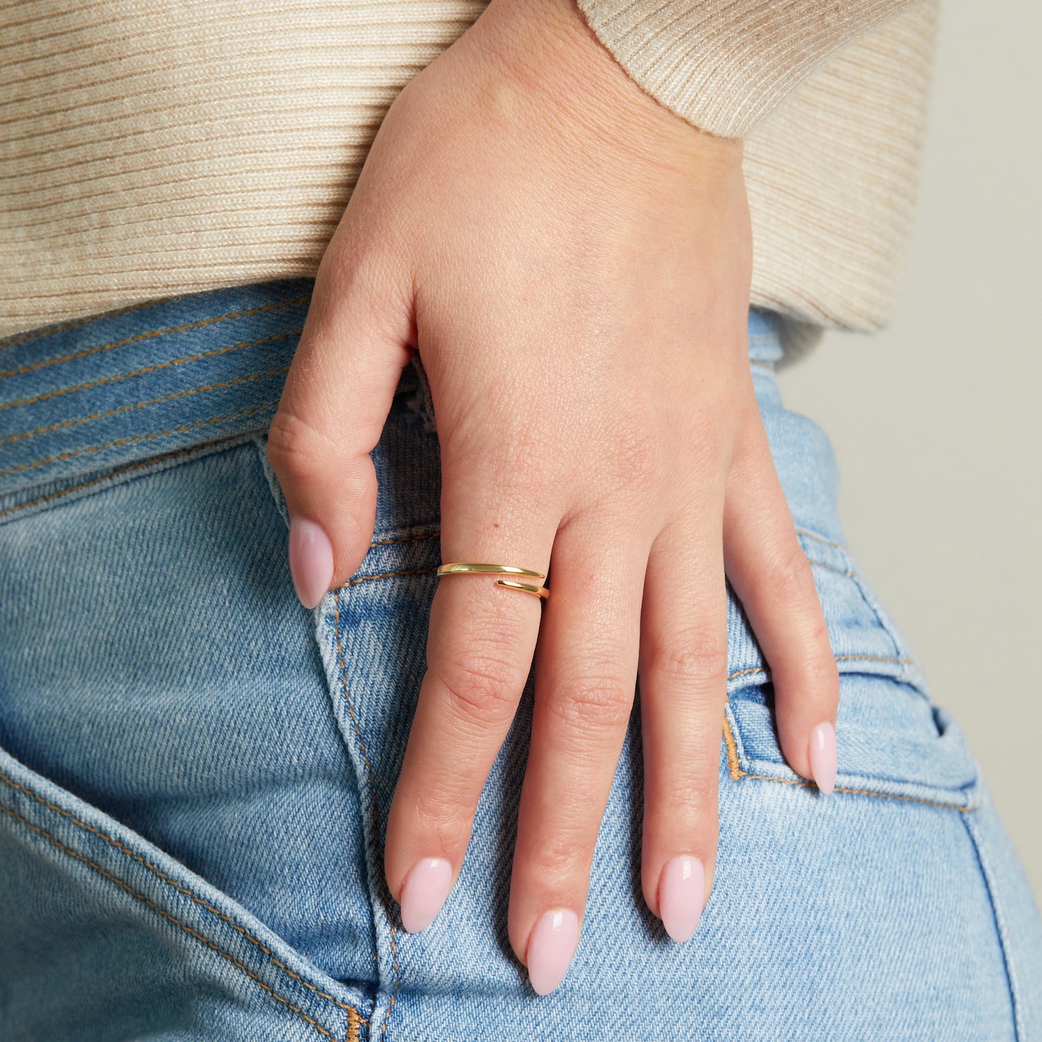 model wearing dainty adjustable spiral ring from Sami Jewels