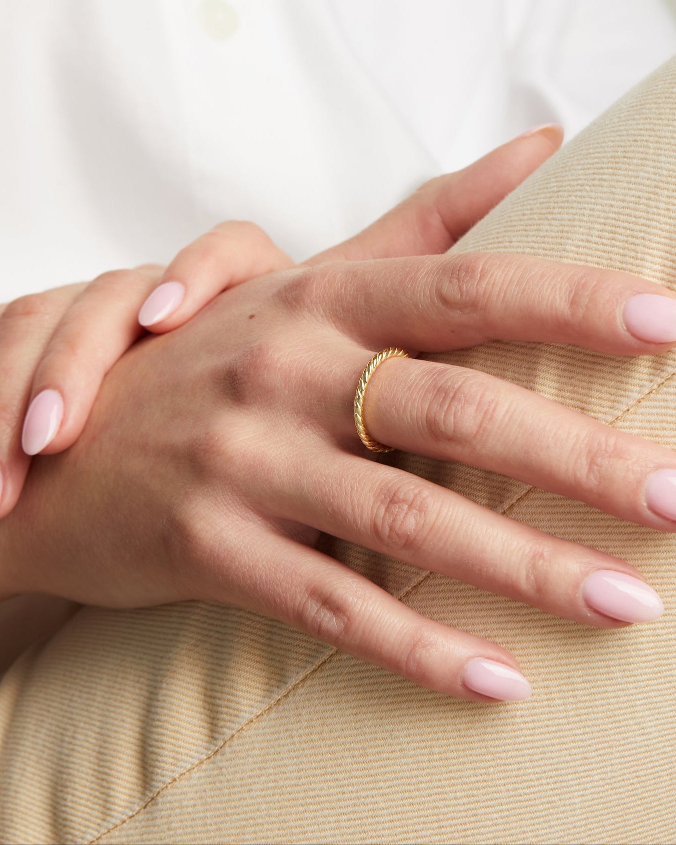 model wearing gold stacking ring 