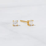 Solitaire 14k Gold Plated Sterling Silver Stud Earrings on white background